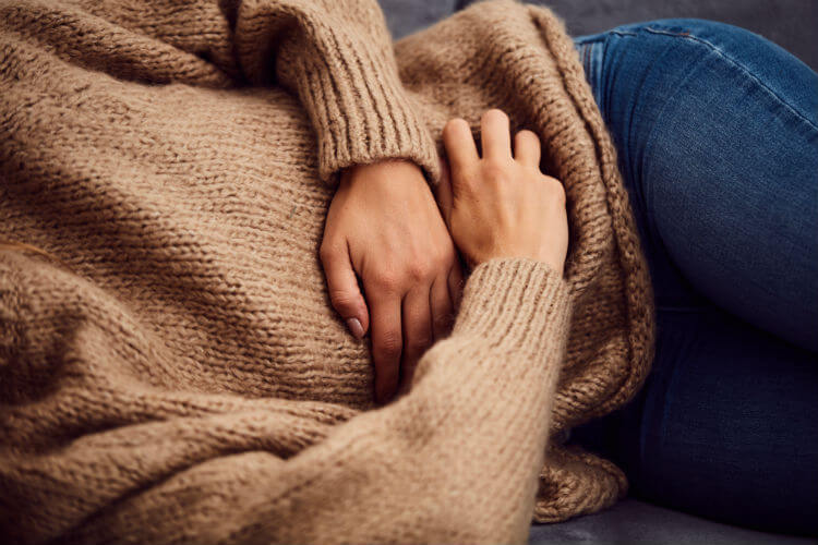 A woman wanting to understand the relationship between chiropractic and crohn's disease